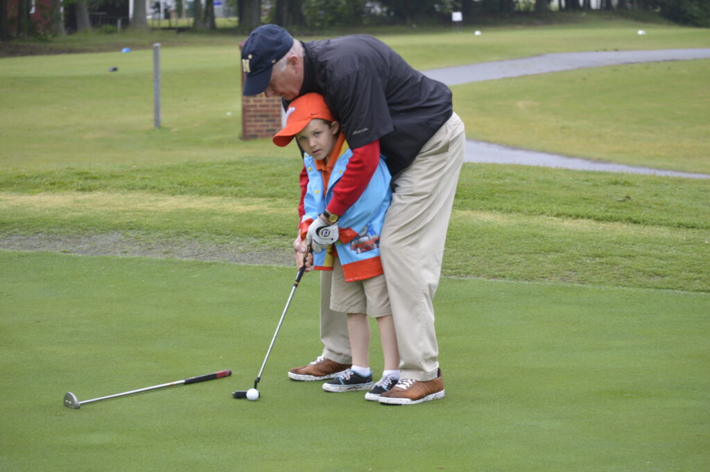 A young golfer at the RW Towne Golf Tournament