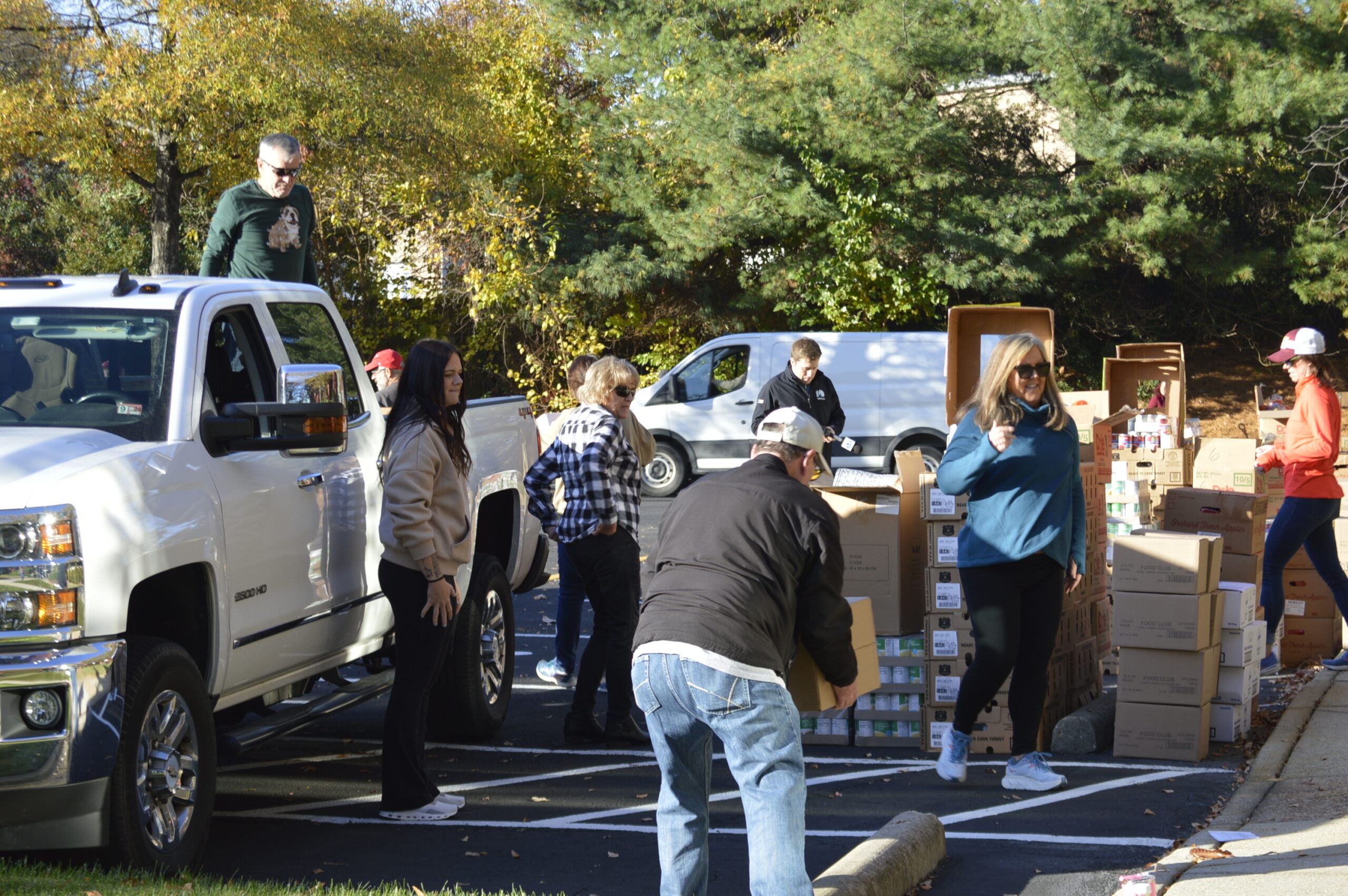 Turkey Brigade volunteers loading trucks with meal boxes