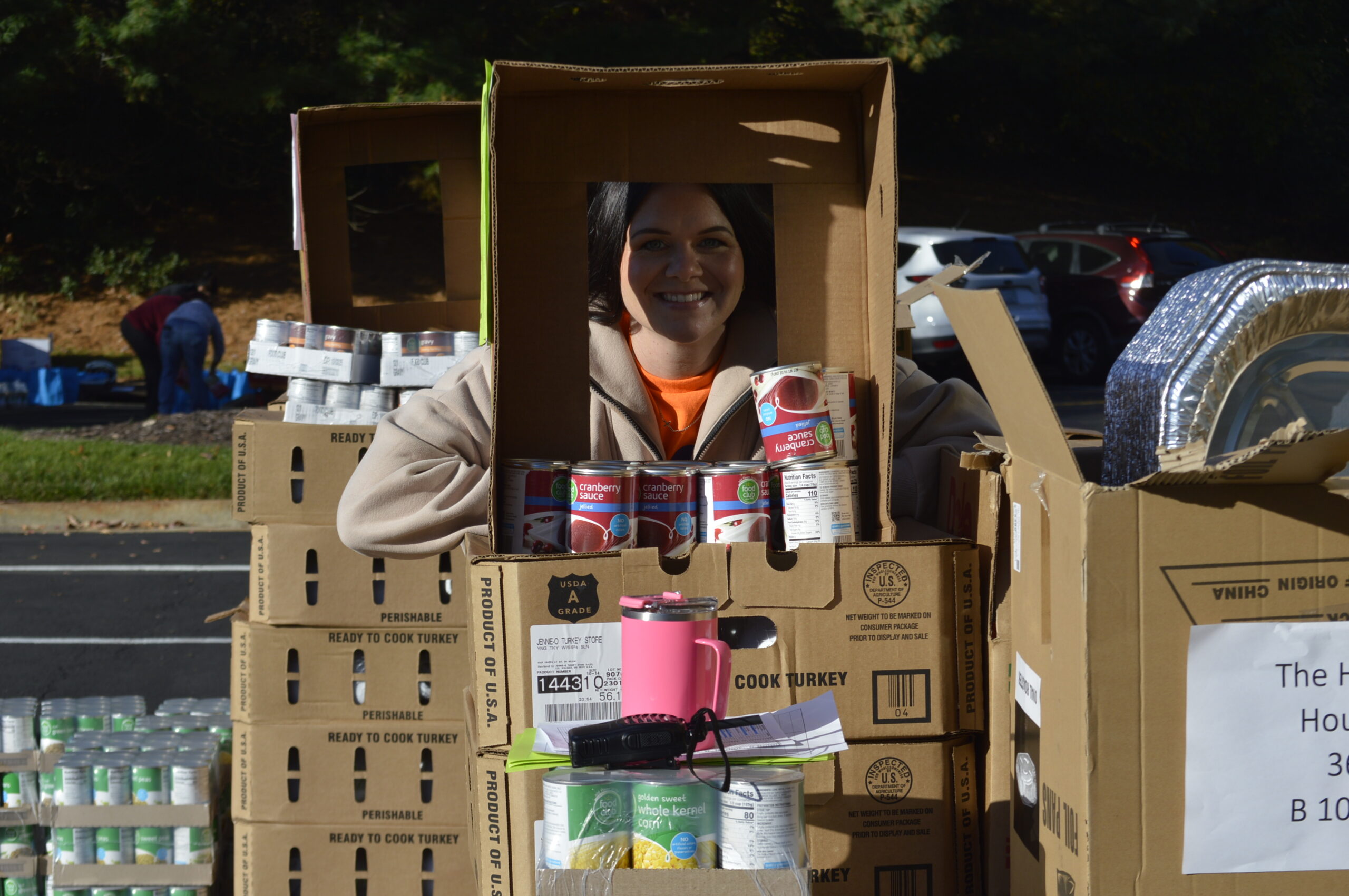 Volunteer packing boxes of donated food