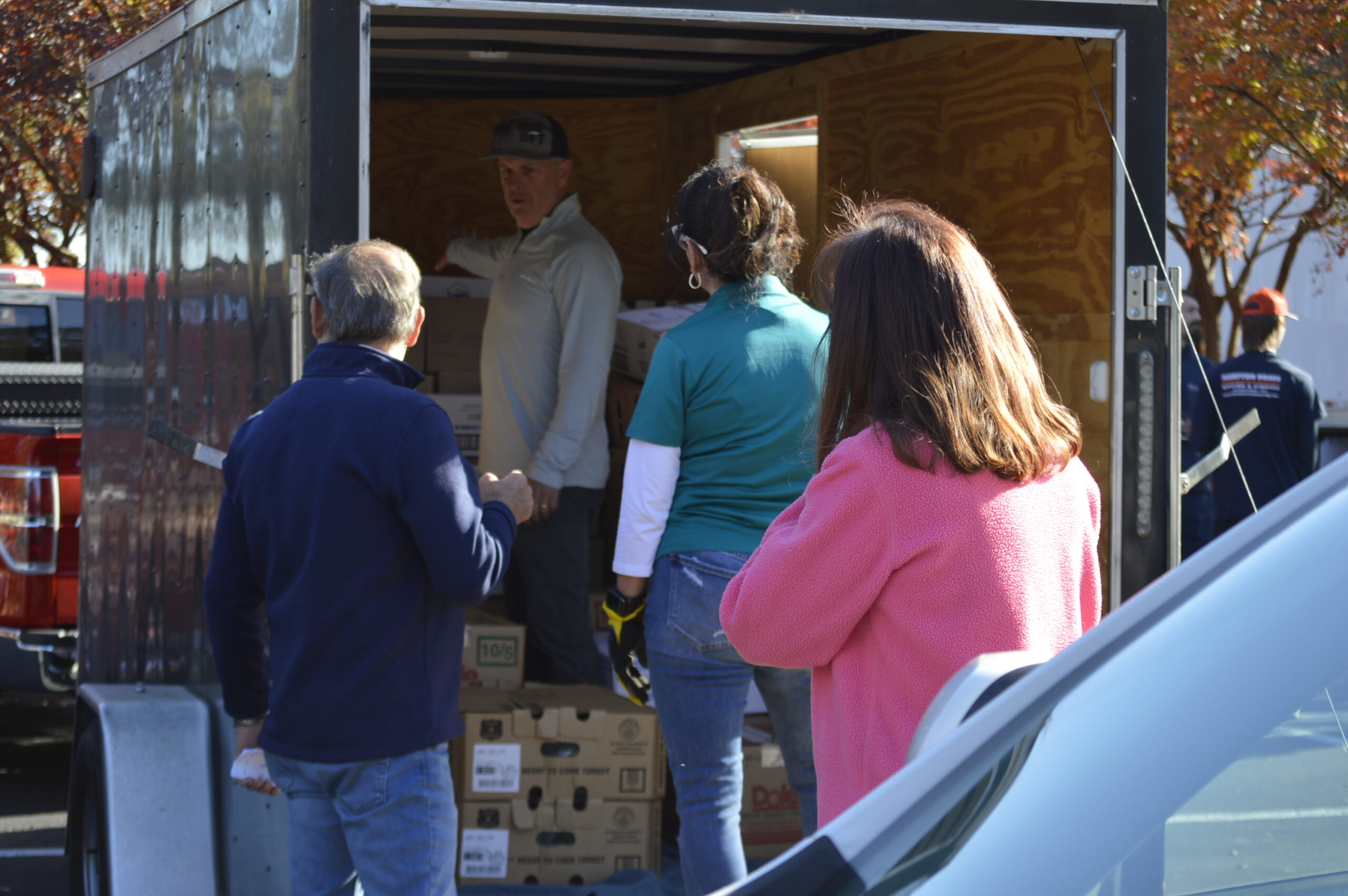 Volunteers unloading donations from a truck