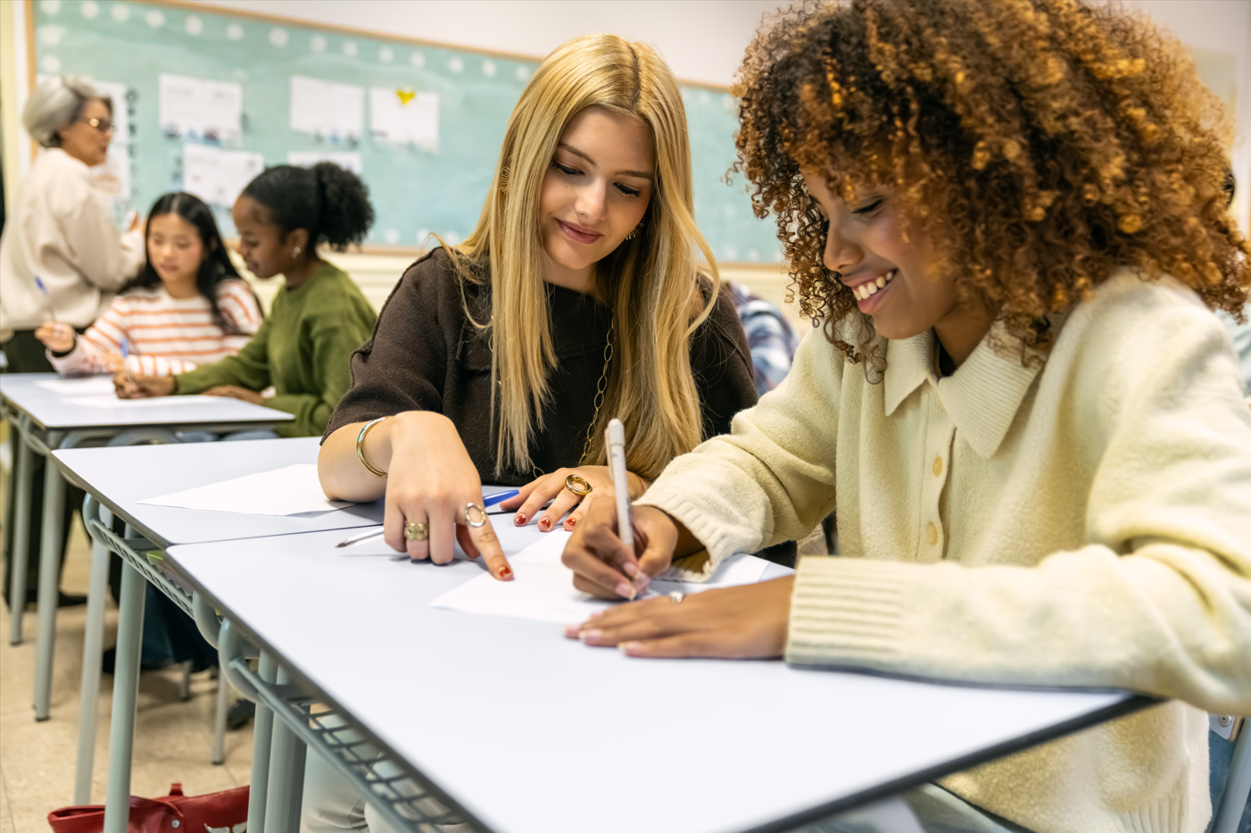 Students working at desks in a classroom