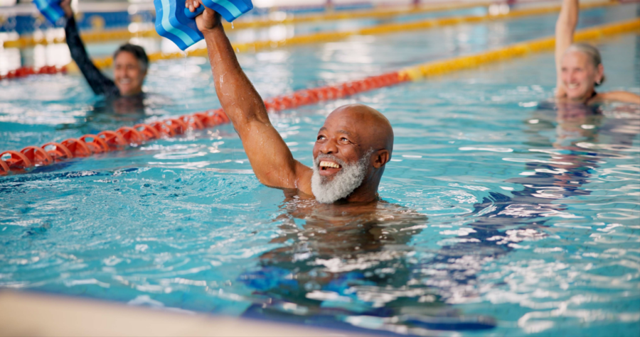 Older man swimming laps in a pool